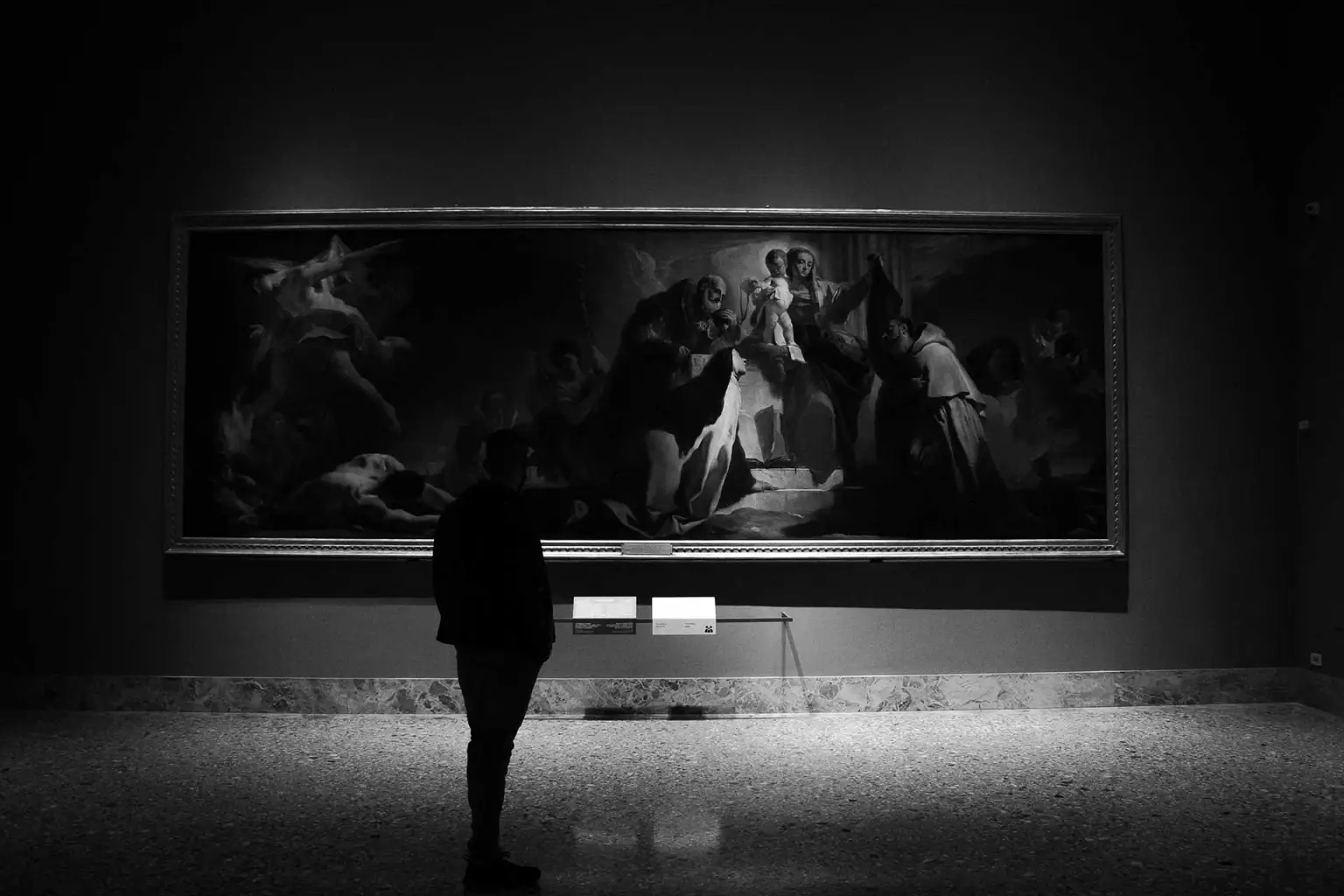 Person walking through gallery